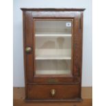 An oak display cabinet with a drawer, 61cm tall x 41cm x 20cm