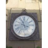 A large Quartz Garden clock with distressed finish 127 cm by 97 cm in working order