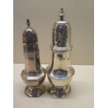 Two silver sifters, 19cm and 17cm tall, some wear to hallmarks and denting to bases, otherwise good,