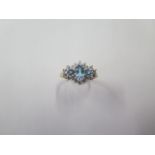 A 9ct yellow gold blue topaz and CZ dress ring, size M, approx 2.4 grams, in good condition