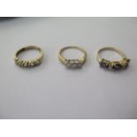 Two 9ct gold rings, size J/K and a 10ct ring size K, total approx 5 grams, 3 stone ring is set