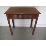 A new walnut two drawer side table on square chamfered legs, made by a local craftsman to a high