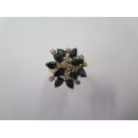 A 14ct yellow gold sapphire and diamond cluster ring, size M/N, head approx 20mm wide, approx 6.4