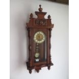 An 8 day walnut case Austrian wall clock, 85cm tall, running