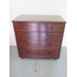 An early 19th century mahogany and oak lined 2 over 3 chest of drawers on turned feet, in good