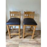 A pair of oak bar stools