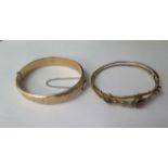 Two 9ct yellow gold hinged bangles, 6.5cm x 5.5cm external, total weight approx 20.9 grams, clasps