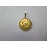 A George V gold half sovereign 1913 in a gilt metal mount, approx 4.7 grams