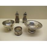 Two silver dishes, 2 silver peppers and a silver serviette ring, total weight approx 7.4 troy oz,