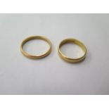 Two 22ct yellow gold band rings, sizes P and S, total weight approx 6.6 grams, slight bending to