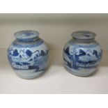 A pair of blue and white Oriental lidded ginger jars, 17cm tall x 15cm wide, one has a small chip to