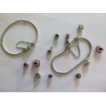Two Pandora silver bracelets and eleven charms, all generally good