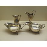 Two silver sauce boats and two silver cream jugs, total weight approx 12.1 troy oz, all have some