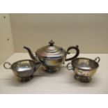 A silver three piece tea set, Birmingham 1930/31, approx 20.7 troy oz, engraved with some wear to