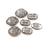 A set of three Victorian silver wine labels, by John Figg, London 1838, shaped oval form, pierced
