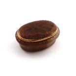 An 18th century gold-mounted carved agate snuff box, unmarked, probably German, oval form, the