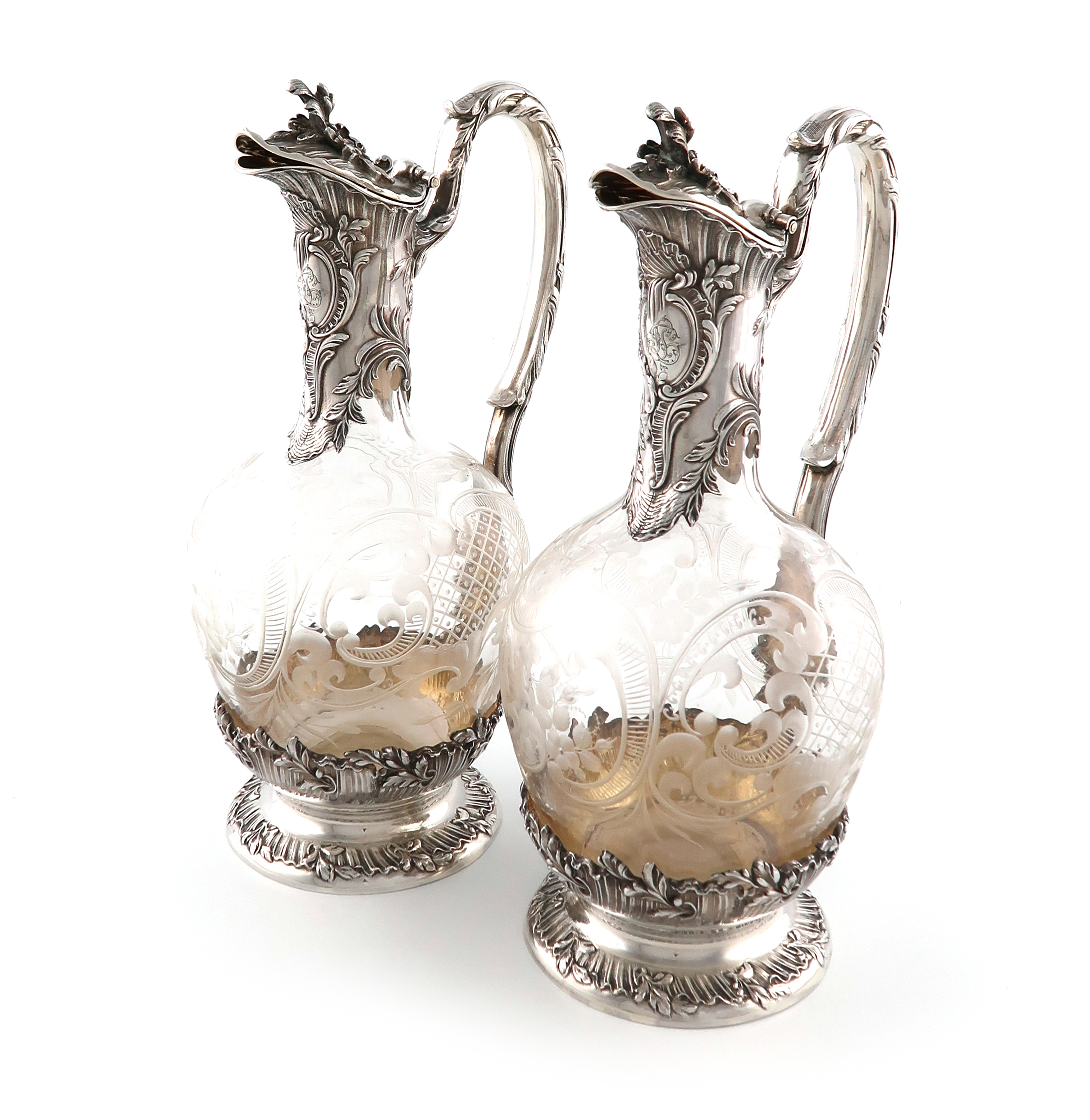 A pair of French silver-mounted glass claret jugs, by The Tetard Brothers, circa 1900, baluster