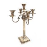 An Edwardian silver five-light candelabrum. by Mappin and Webb, Sheffield 1907, Corinthian column