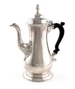 A George III silver coffee pot, by William Grundy, London 1763, baluster form, scroll handle,