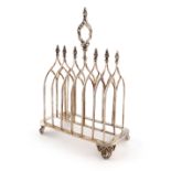 A Victorian silver seven-bar toast rack, by John Gammage, Birmingham 1843, of Gothic arch form,