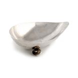 A Chinese silver shell dish, retailed by Wang Hing, shaped form, on three shell feet, length 18.8cm,