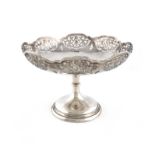 A silver tazza, by Walker and Hall, Sheffield 1924, circular form, pierced with panels of foliate