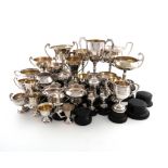 A collection of metalware and electroplated trophy cups, comprising three of vase form, three of