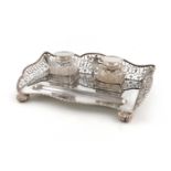 A silver inkwell, by Wigful and Lee, Sheffield 1911, rectangular form, pierced gallery, with a pen