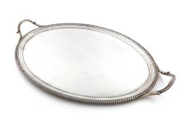 A George III silver two-handled tray, by Hannam and Crouch, London 1800, oval form, leaf capped