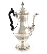 A George III silver coffee pot, maker's mark of L.H, not traced, London 1768, baluster form,