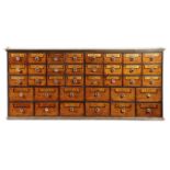 AMENDED - A BANK OF MAHOGANY AND PINE APOTHECARY DRAWERS 19TH CENTURY AND LATER