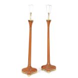 A PAIR OF LEATHER AND BRASS STANDARD LAMPS 20TH CENTURY of triform shape (2) 149.5cm high