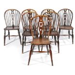 A HARLEQUIN SET OF SEVEN ASH AND YEW WINDSOR SIDECHAIRS LATE 18TH / EARLY 19TH CENTURY each with a