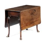 A GEORGE II MAHOGANY DINING TABLE MID-18TH CENTURY the drop-leaf top with re-entrant corners and a