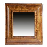 A WILLIAM AND MARY WALNUT CUSHION FRAME WALL MIRROR LATE 17TH / EARLY 18TH CENTURY with a later