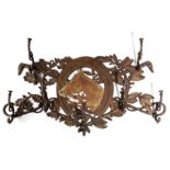 A CAST IRON HUNTING WHIP RACK LATE 19TH / EARLY 20TH CENTURY decorated with a horse's head, within a