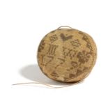 A GEORGE III NEEDLEWORK SAMPLER PIN BALL DATED '1779' worked with flowers and geometric designs in