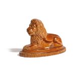 A BROWN STONEWARE POTTERY MODEL OF A RECUMBENT LION C.1840 on an oval stepped base with a ribbed