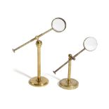 TWO VICTORIAN BRASS SCIENTIFIC MAGNIFYING GLASSES LATE 19TH CENTURY each with a bull's eye lense and