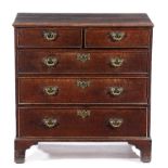 A GEORGE III MAHOGANY OAK CHEST C.1770 of narrow proportions, the top with a moulded edge above