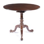 A GEORGE II MAHOGANY TRIPOD TABLE C.1750-1760 the circular revolving tilt-top on a birdcage and on