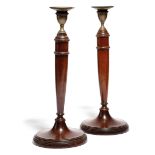 A PAIR OF MAHOGANY CANDLESTICKS IN GEORGE III STYLE 19TH CENTURY each with a vase shape nozzle and a