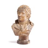 A FRENCH PATINATED PLASTER BUST OF A GENTLEMAN LATE 19TH / EARLY 20TH CENTURY signed 'J B Cheret