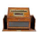 AN EDWARDIAN OAK AND BRASS COUNTRY HOUSE LETTER BOX EARLY 20TH CENTURY with a hinged lid with a