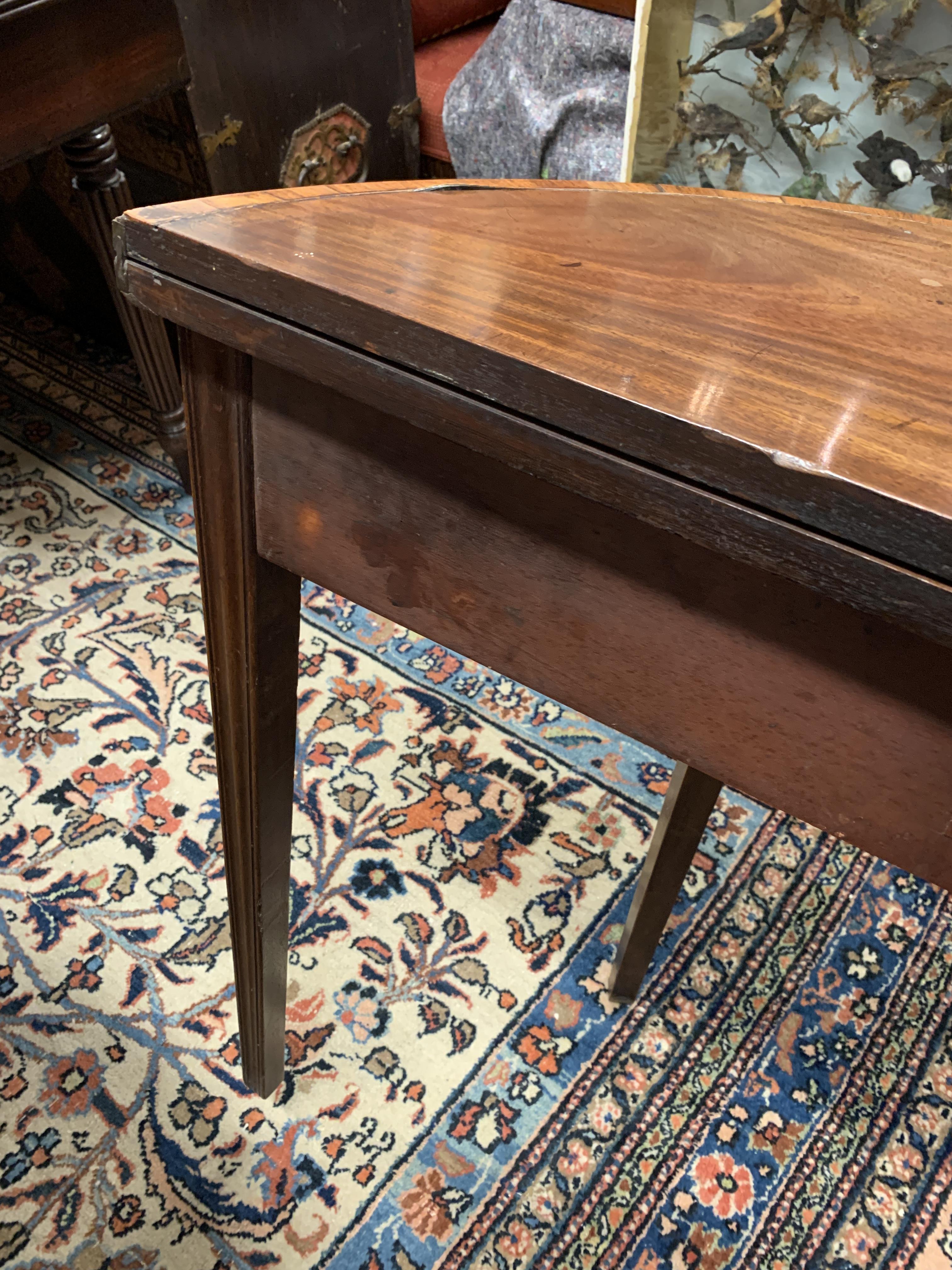 A GEORGE III MAHOGANY DEMI-LUNE TEA TABLE LATE 18TH CENTURY with a crossbanded top on moulded legs - Image 5 of 8