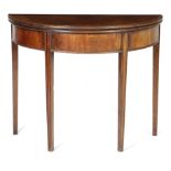 A GEORGE III MAHOGANY DEMI-LUNE TEA TABLE LATE 18TH CENTURY with a crossbanded top on moulded legs