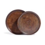 TWO GEORGE III MAHOGANY WINE COASTERS LATE 18TH CENTURY each with a dished top (2) 16cm diameter