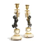 A NEAR PAIR OF REGENCY GILT AND PATINATED BRONZE FIGURAL CANDLESTICKS EARLY 19TH CENTURY each