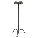 A WROUGHT IRON STAND POSSIBLY 17TH / 18TH CENTURY with a pierced top, on tripod supports 72.8cm high