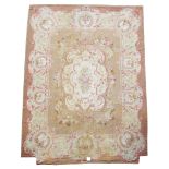 A FRENCH AUBUSSON TAPESTRY CARPET 19TH CENTURY the ivory field with scrolling foliate designs,